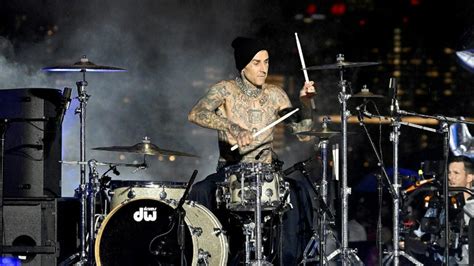 Travis Barker Surprises NYFW With Drum Solo In The Rain | iHeart