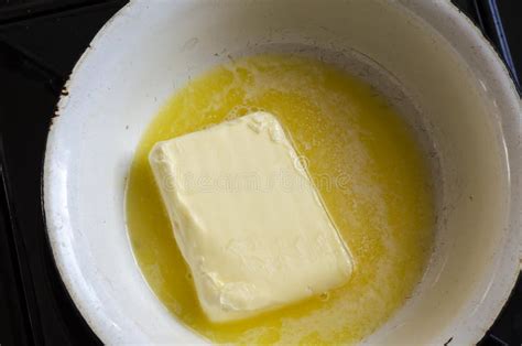 Melt the Butter in a White Metal Bowl on the Kitchen Stove Stock Photo ...