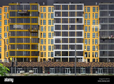 Yellow building architecture in the city Stock Photo - Alamy