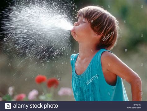 A boy is spitting with water Stock Photo: 26598479 - Alamy