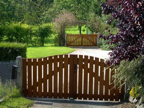 Simple wooden gates in a beautiful Normandy garden. | Garden gate ...