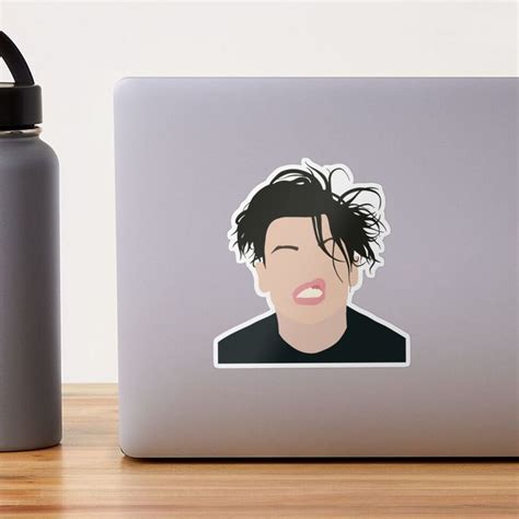 a sticker of a man with his hair blowing in the wind on a laptop