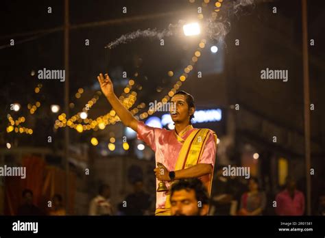 Ganga aarti, Portrait of an young priest performing river ganges ...