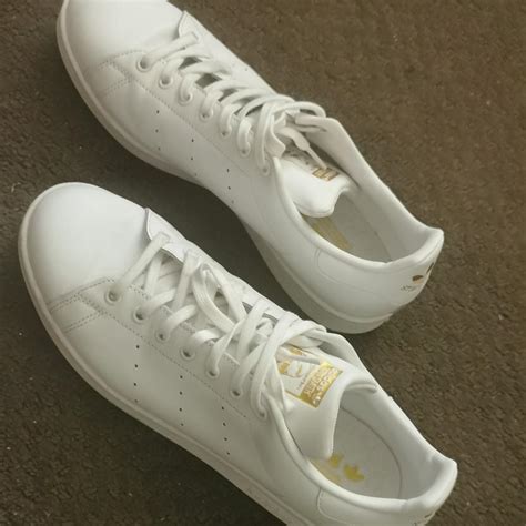 Adidas Stan Smith White sneakers and a gold accent,... - Depop