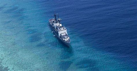 Philippine warship runs aground in disputed South China Sea