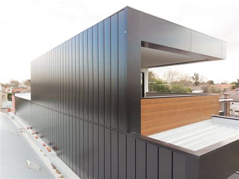 the roof of a modern house with wooden slats