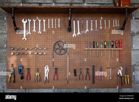 Set of old tools on wooden background in workshop Stock Photo - Alamy