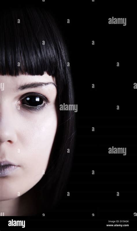 Pale ghost with black eyes, isolated on black background Stock Photo ...