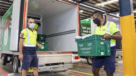 Woolworths cuts delivery costs in online shopping war with Coles | news ...