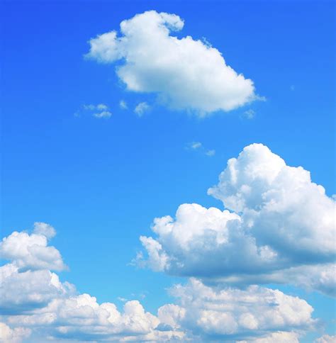 Bright Blue Sky With Puffy Clouds Photograph by Bgfoto