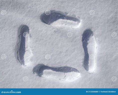 Shoe prints in the snow stock photo. Image of footsteps - 213356680