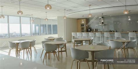 Tables and chairs in modern office cafeteria — nobody, inside - Stock ...