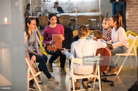 Children And Teachers Singing And Making Music High-Res Stock Photo ...