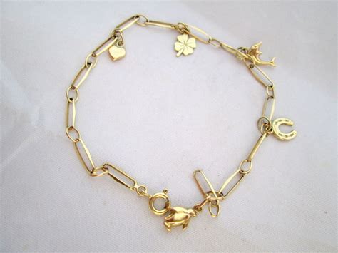 Gold 585 charm bracelet - 5 gold charms - mint - Catawiki