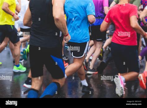 Marathon runners crowd, participants start running the half-marathon in ...