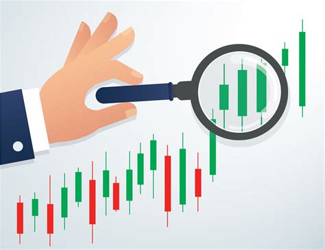 hand holding the magnifying glass and candlestick chart stock market ...