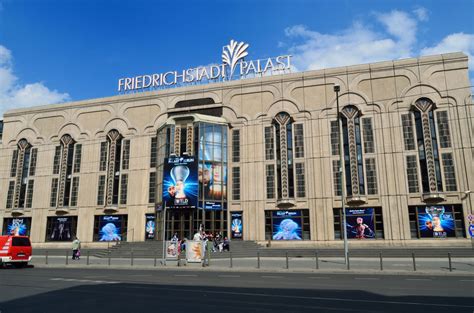 a large building with people walking around it