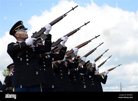 The Louisiana National Guard’s funeral detail conducts a 21-gun salute ...