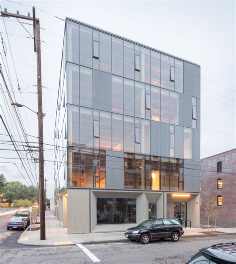 Glass Facade Reveals Timber Structure Of Frame Work Building In ...