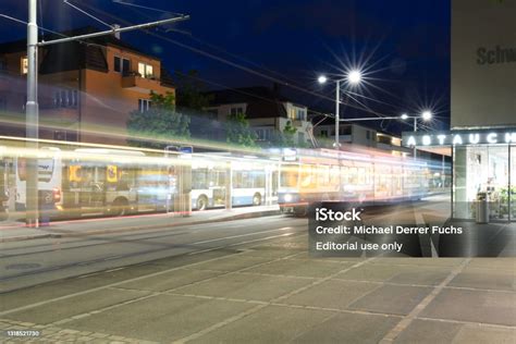 Public Transport Tram And Bus Station By Night Stock Photo - Download ...