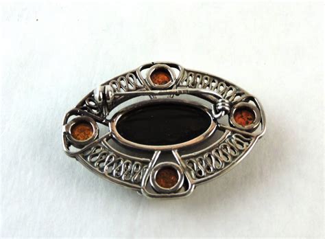 Celtic Design Sterling Silver and Amber Brooch