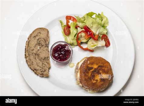 Breaded camembert with salad Stock Photo - Alamy