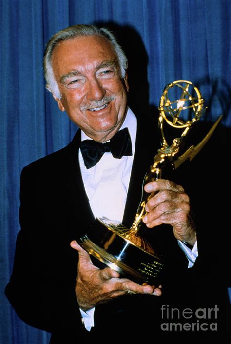 Walter Cronkite Holding Emmy Award by Bettmann