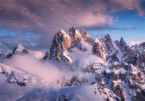 Snowy mountain peaks in fog | Snowy mountains, Winter landscape, Mountains