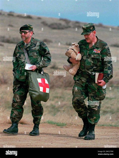 FILE - Norman Olson, right, Michigan militia leader, carrying a stuffed ...