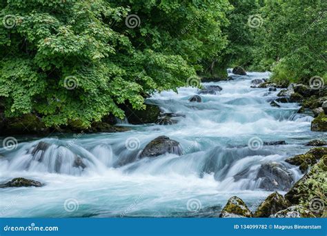 Turquoise Flowing Water in a River in Norway Stock Photo - Image of ...