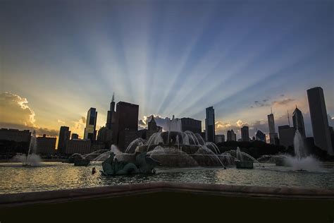 Buckingham Fountain with rays of sunlight Photograph by Sven Brogren ...