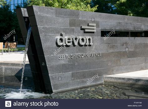 A logo sign outside of the Devon Energy Center, headquarters of the ...