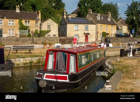 Canal narrowboat passing through Bradford locks on the Kennet and Avon ...