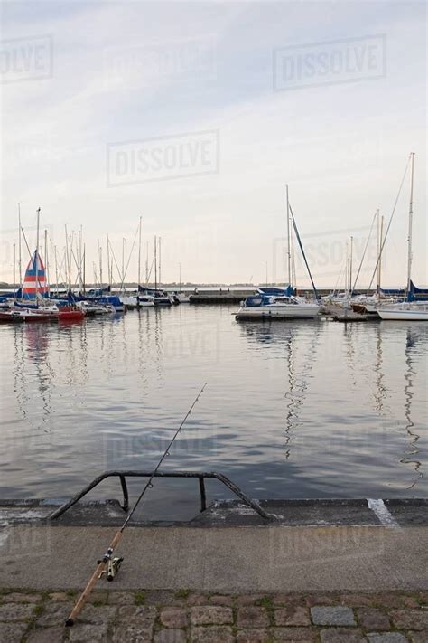 Fishing in harbour - Stock Photo - Dissolve