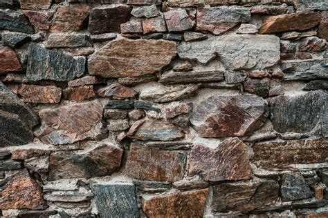 Old stone wall at the castle ruins. Texture of old weathered medieval ...