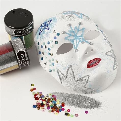 A Face Mask with Glitter on Designs made with transparent Glue