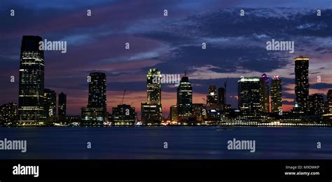 The skyline of Jersey City at sunset Stock Photo - Alamy