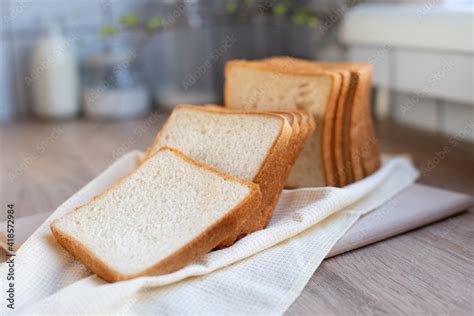 Sliced toast bread on the table in the kitchen, slices of white bread ...