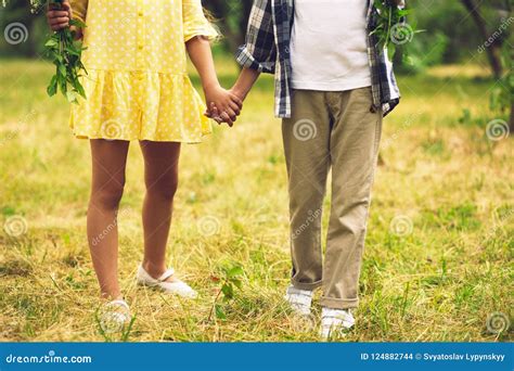 Boy and Girl Holding Hands. Stock Photo - Image of park, love: 124882744