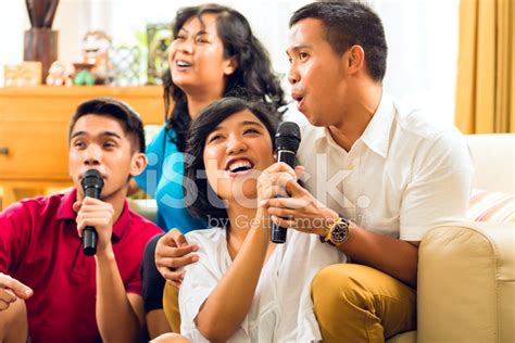 Asian People Singing At Karaoke Party Stock Photo | Royalty-Free ...