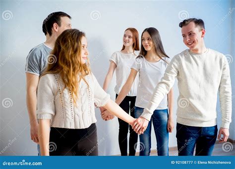 Friends holding hands stock image. Image of connection - 92108777