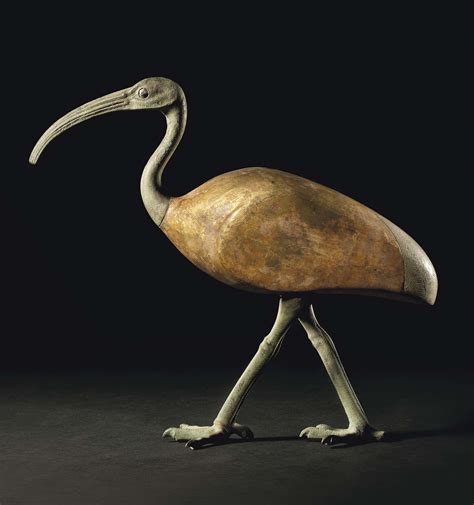 AN EGYPTIAN BRONZE AND GILT WOOD IBIS , LATE PERIOD TO PTOLEMAIC PERIOD ...