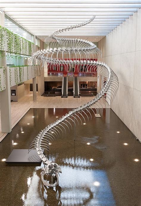 A Giant Aluminum Snake Skeleton Rises from a Pool of Water at the ...