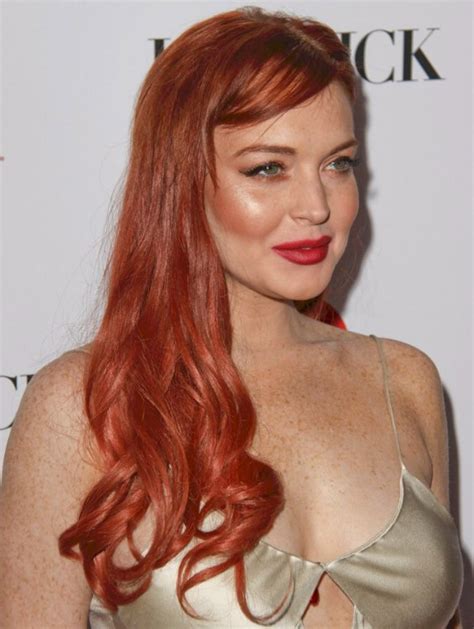 Lindsay Lohan's red hair in a long vintage-inspired hairstyle with curls