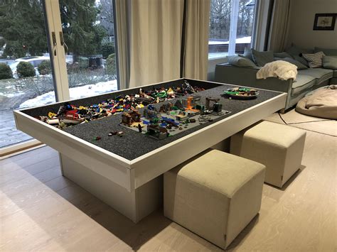 a table that has some legos on it in the middle of a living room