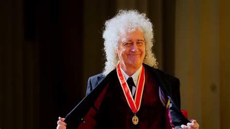 Queen guitarist and astrophysicist Brian May knighted by King Charles ...