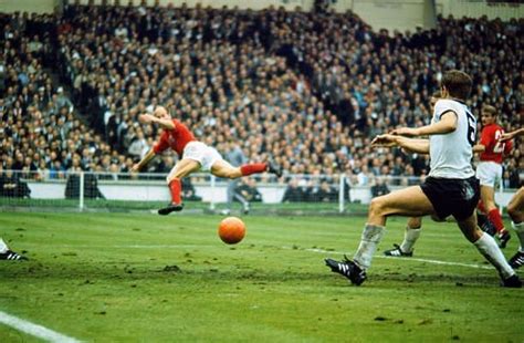 England 4 W Germany 2 in 1966 at Wembley. Bobby Charlton heads the ball ...