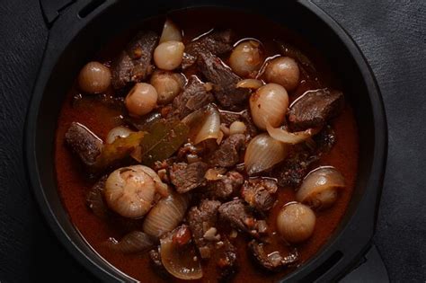 Premium Photo | Greek beef stifado. stew with beef, onion bulbs ...