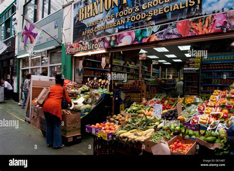 Brixton Market shops and stalls with multicultural fruit and veg Stock ...