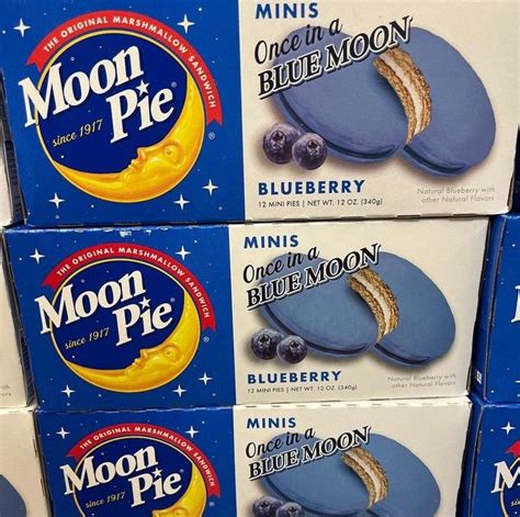 four boxes of moon pie blueberry cheesecakes are stacked on top of each ...